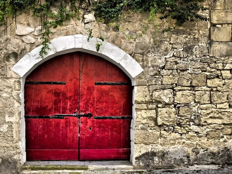 Medieval Red Door © Depositphotos