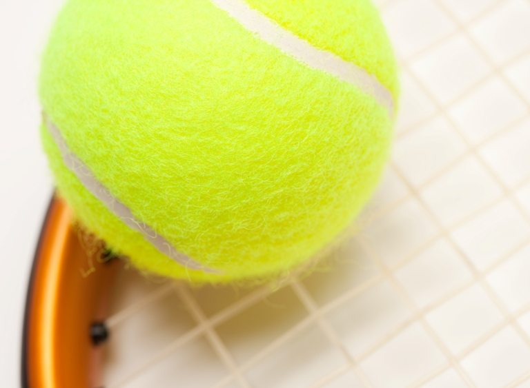 Abstract Tennis Ball, Racquet and Nylon Strings. © Depositphotos