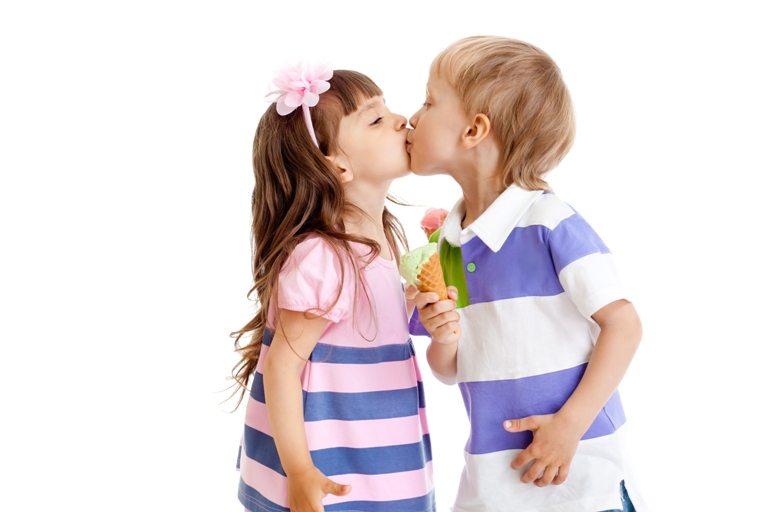 Girl and boy are kissing with ice cream in hands isolated | Stock Photo © Depositphotos