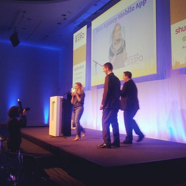 Elena Flanagan-Eister on stage receiving the Best agency Mobile app Awards for Clashot