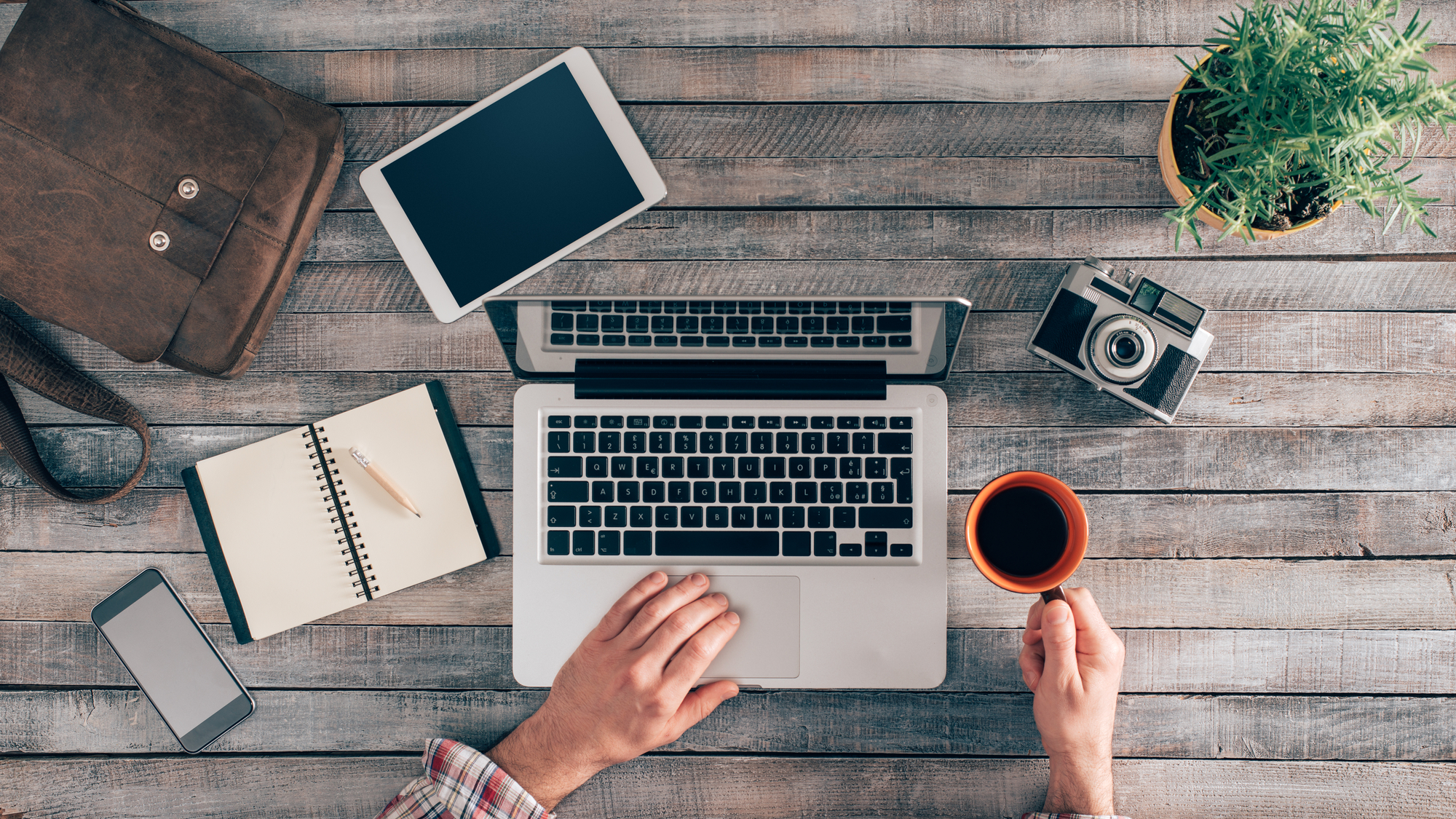 Hipster desktop with male hands