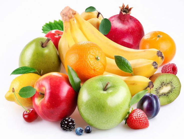 Handful of fruit and berries on a white background