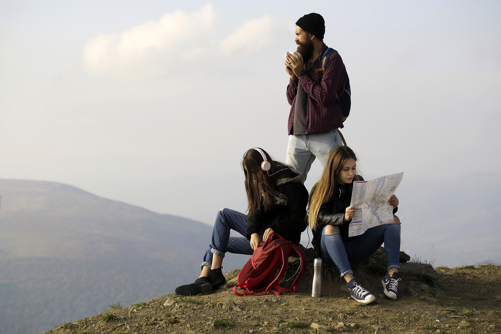 Young travelers with map