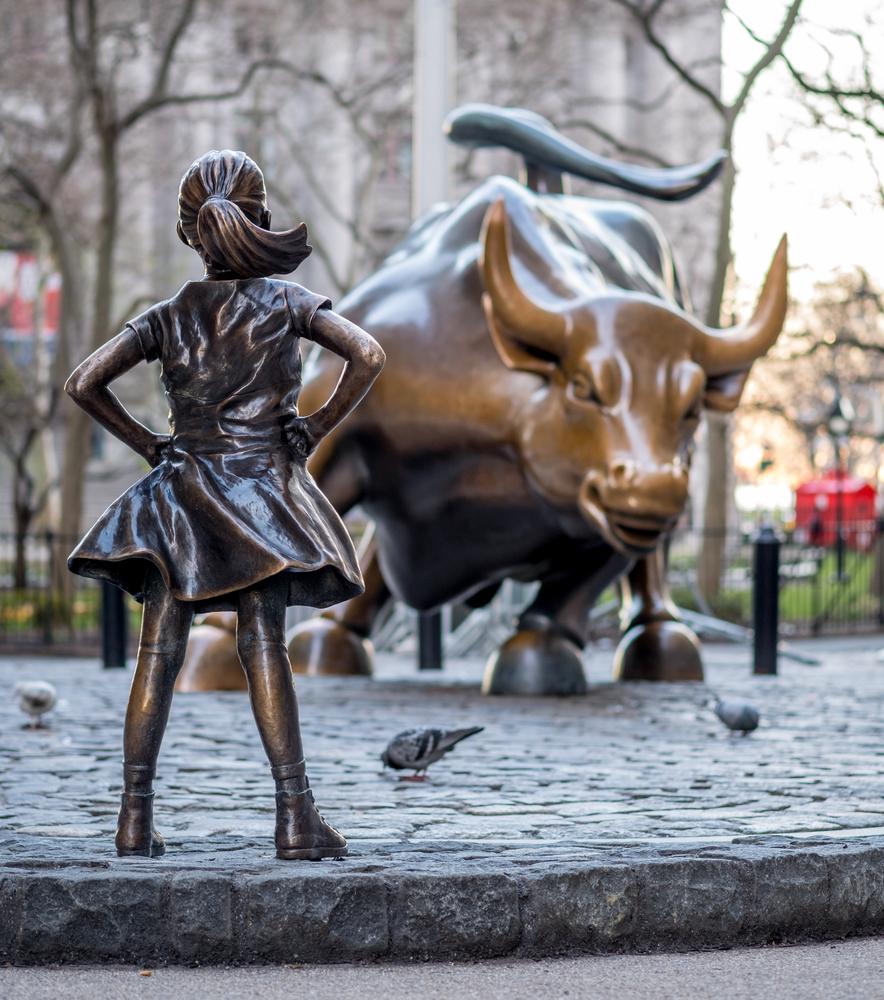 “The Fearless Girl” statue facing Charging Bull in Lower Manhatt