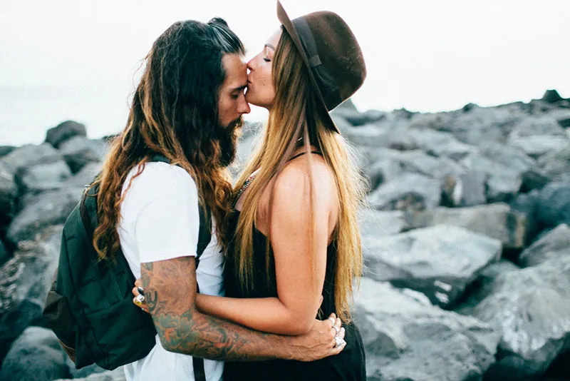 photo of a couple by the beach