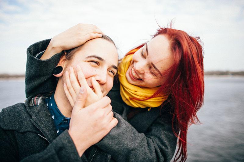 photo of a happy couple by the water