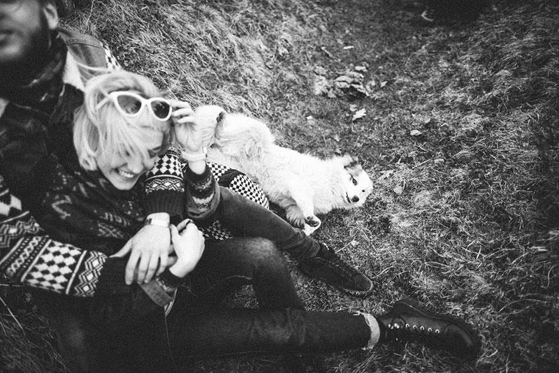 black and white photo of a couple and their dog