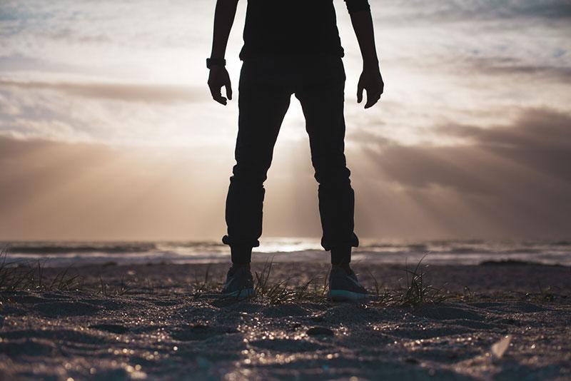 Justin Govender man standing on the beach