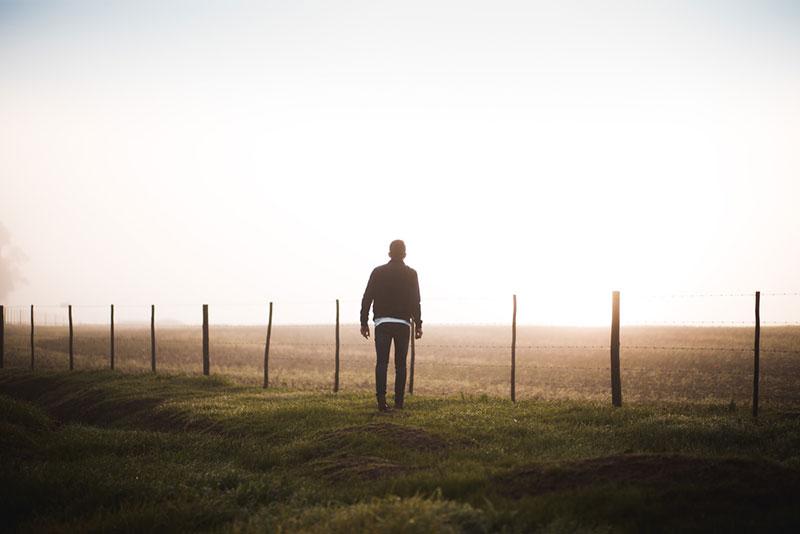 Justin Govender photography man walking into foggy field