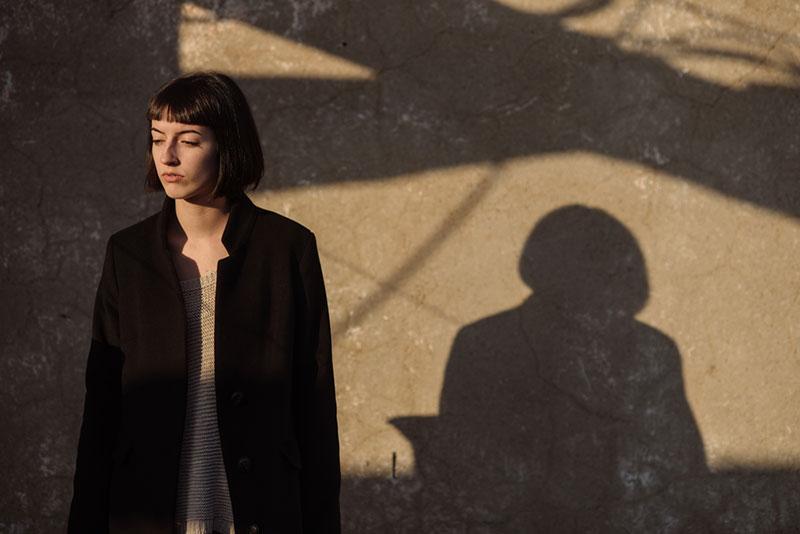 Mihajlo Ckovric stock photography of woman and her shadow on the wall