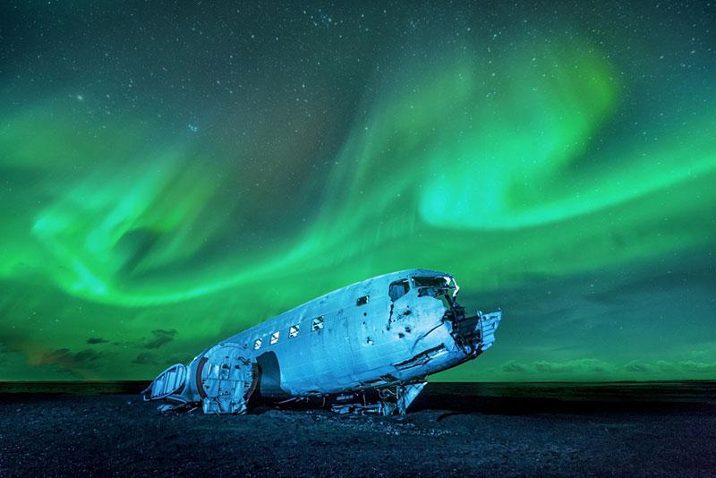 Northern lights over plane wreckage, Iceland