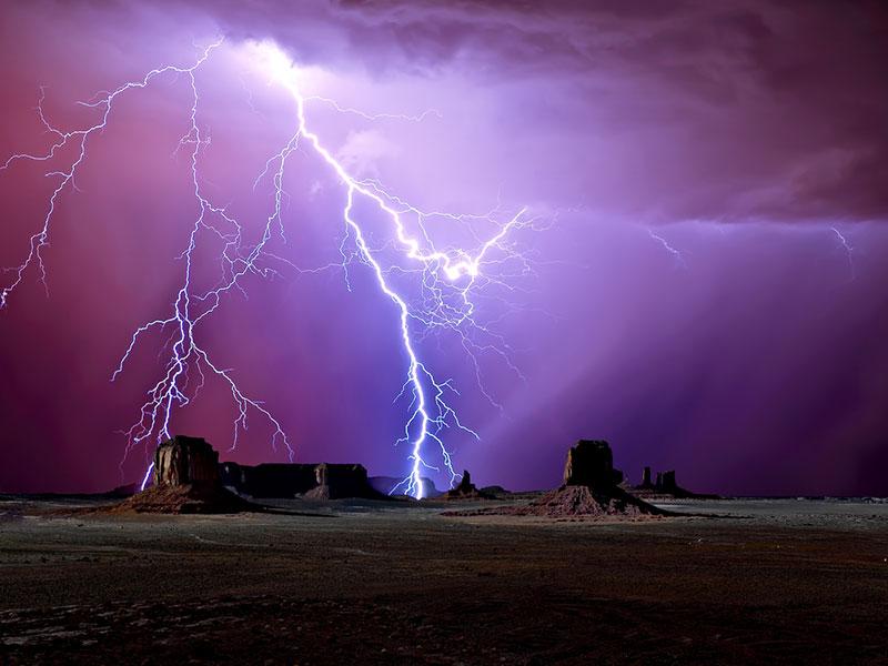 Scenic view of majestic lightning over Monument Valley, Arizona, America, USA