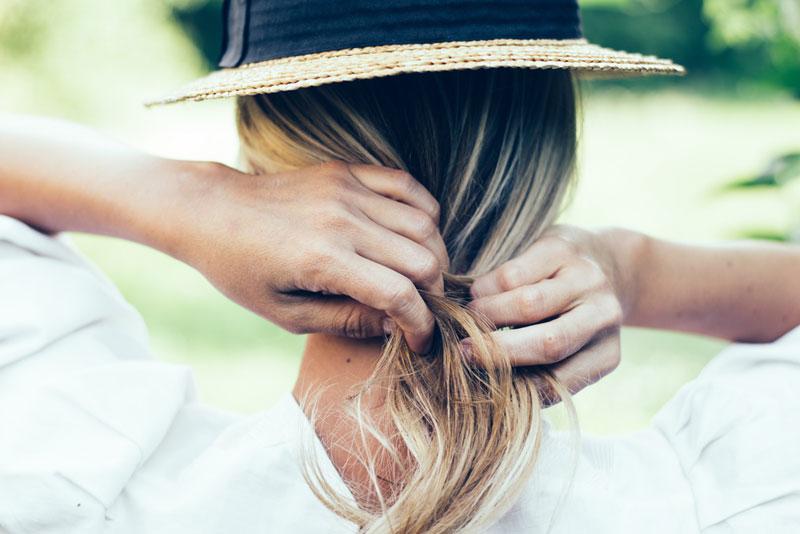 László Lőrik photography - woman tying her hair