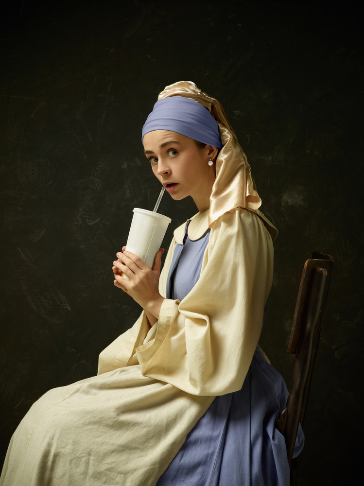 Medieval Woman in Historical Costume Wearing Corset Dress and Bonnet.