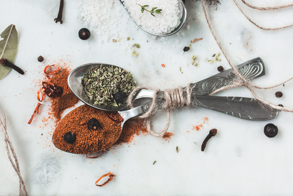 Spices in spoons top view