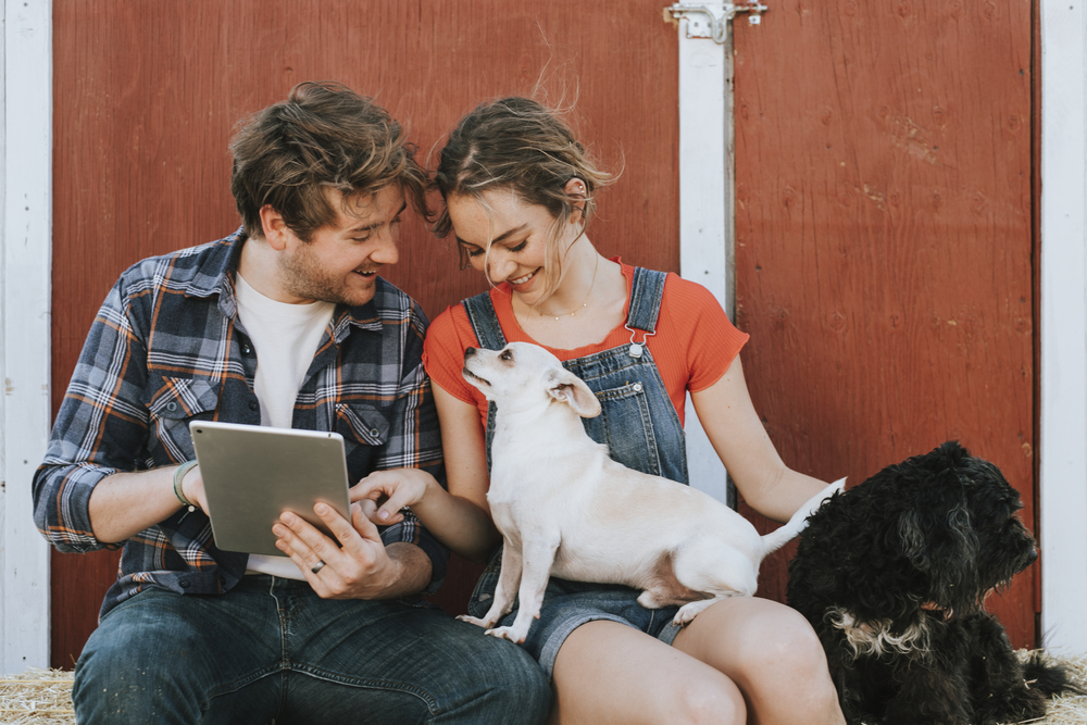 Happy couple living with dogs