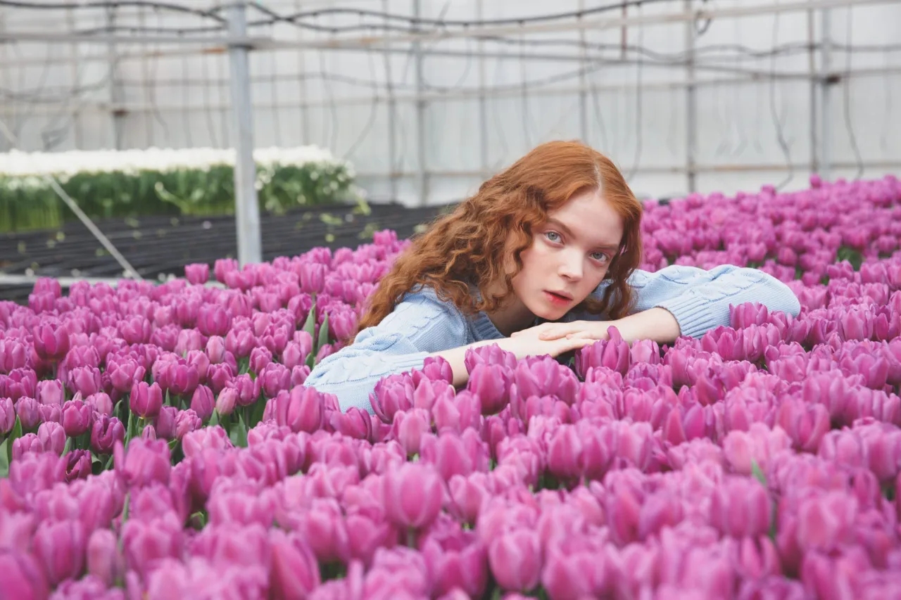 Girl lying on tulips