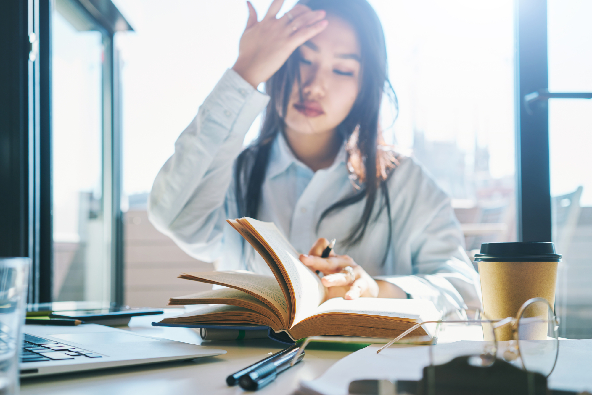 Photo of asian woman reading book