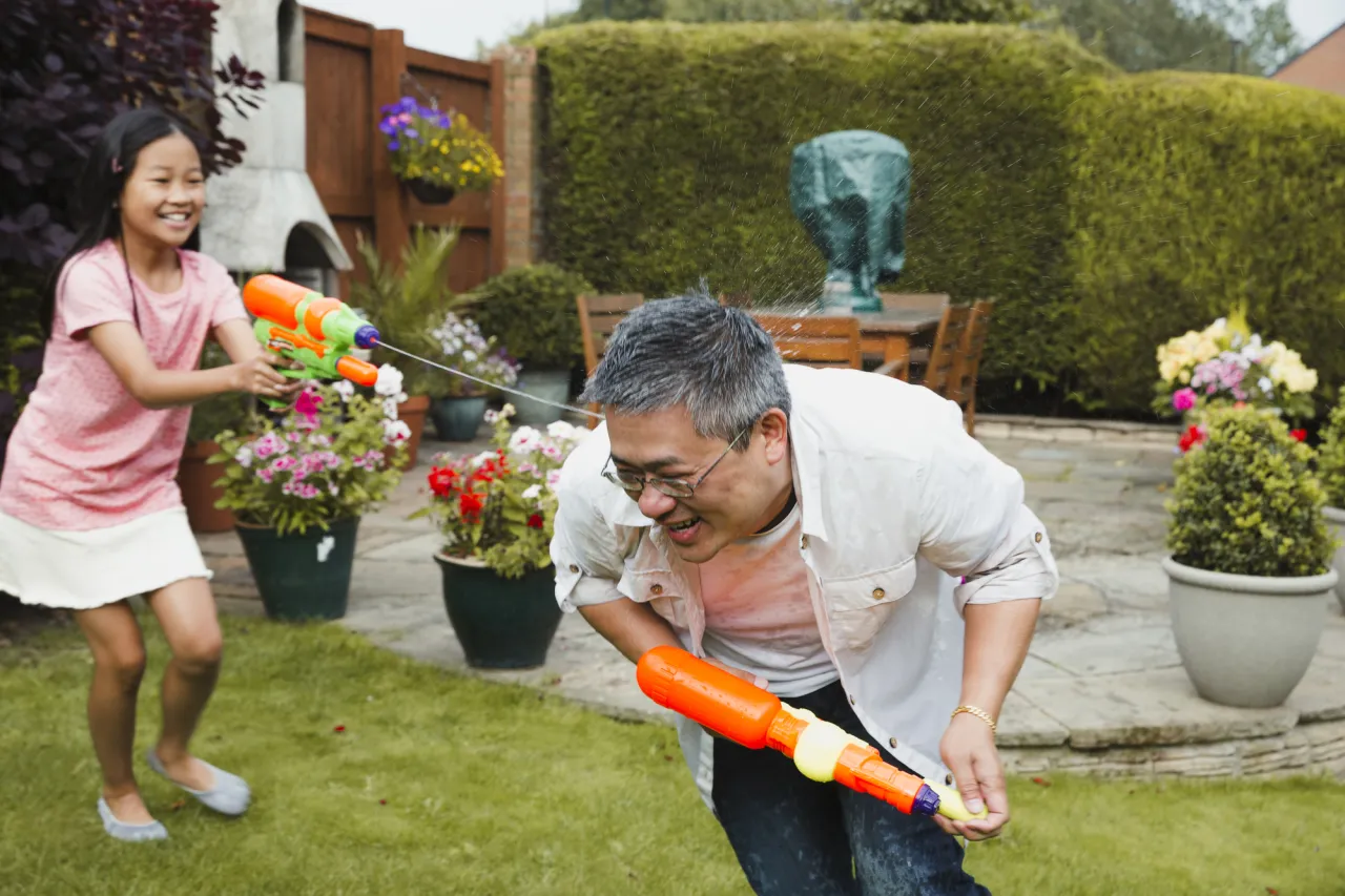 Little girl and her father having fun stock photo