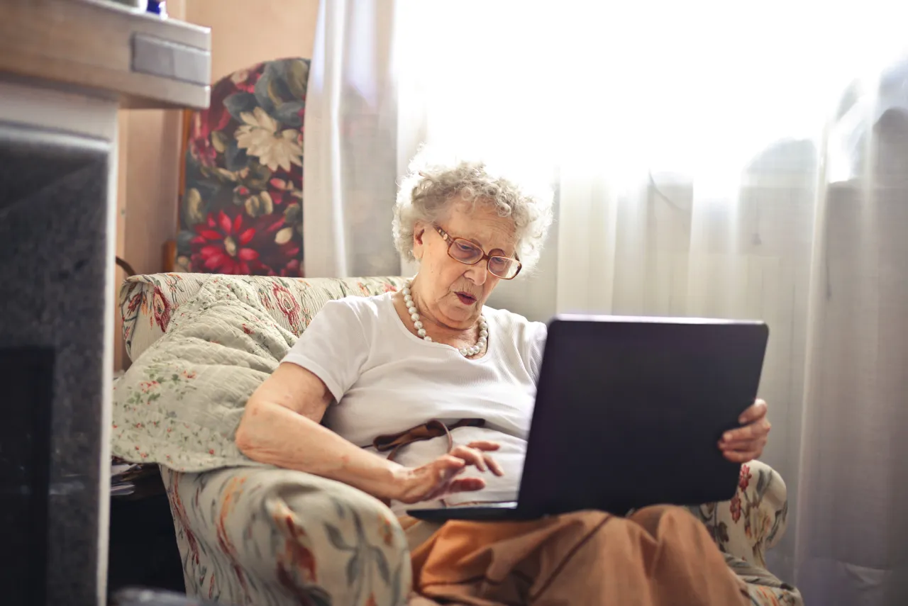 old woman with a laptop stock image