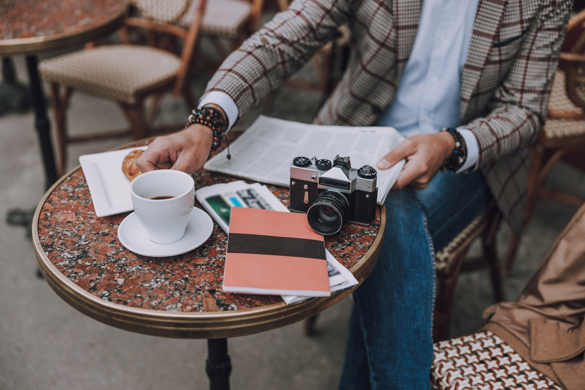 Close up of a cafe table with coffee croissant