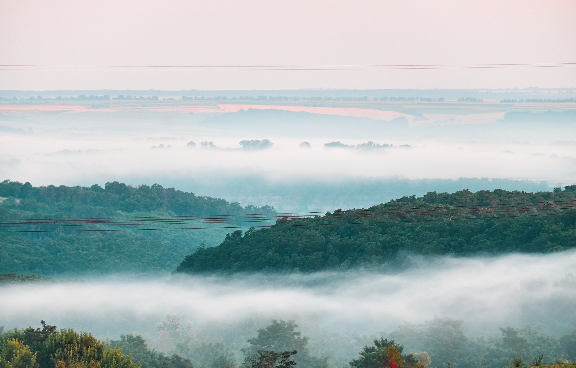 Green hills in the morning mist stock photo