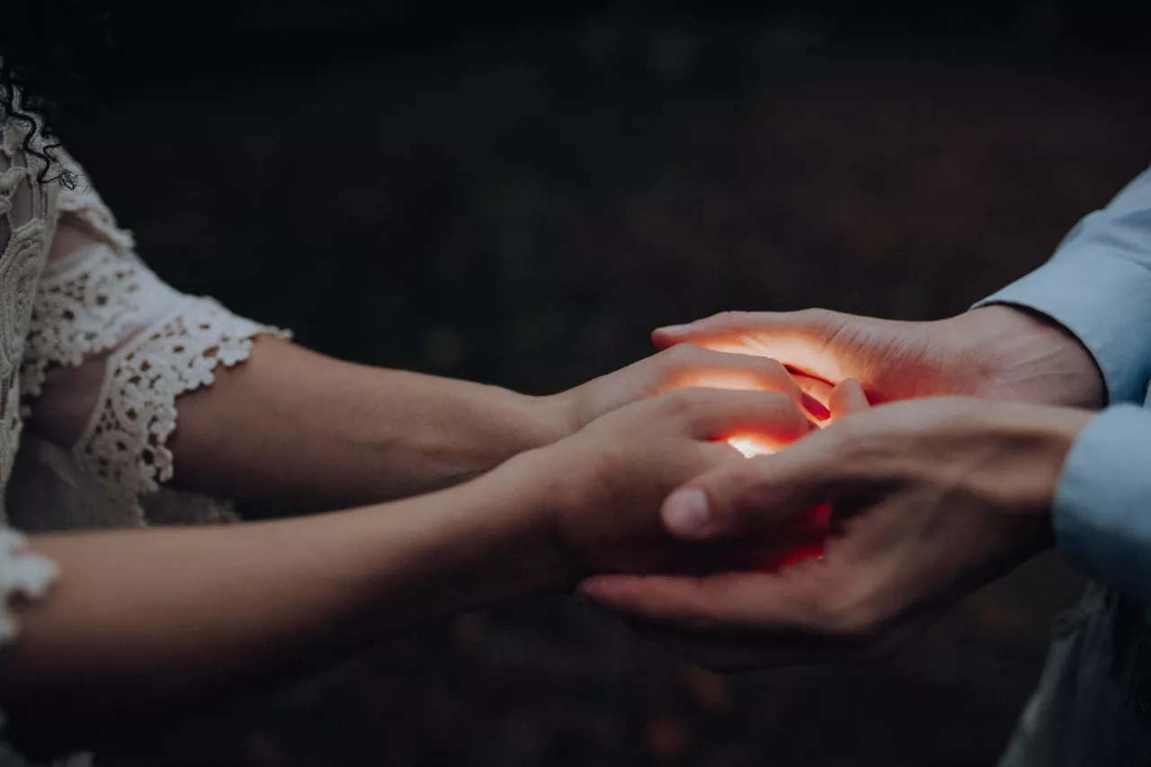 stock image man and woman holding hands