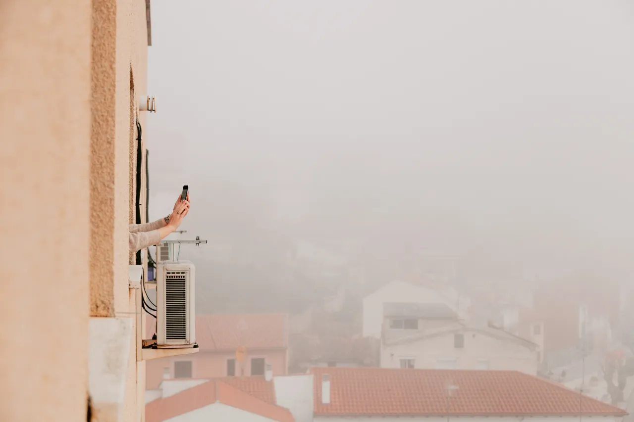 Woman arms out of the window stock photo