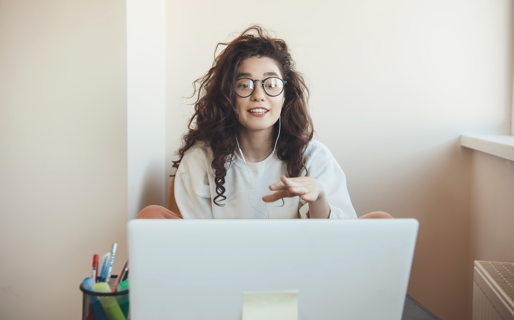 Curly haired woman with eyeglasses stock photo