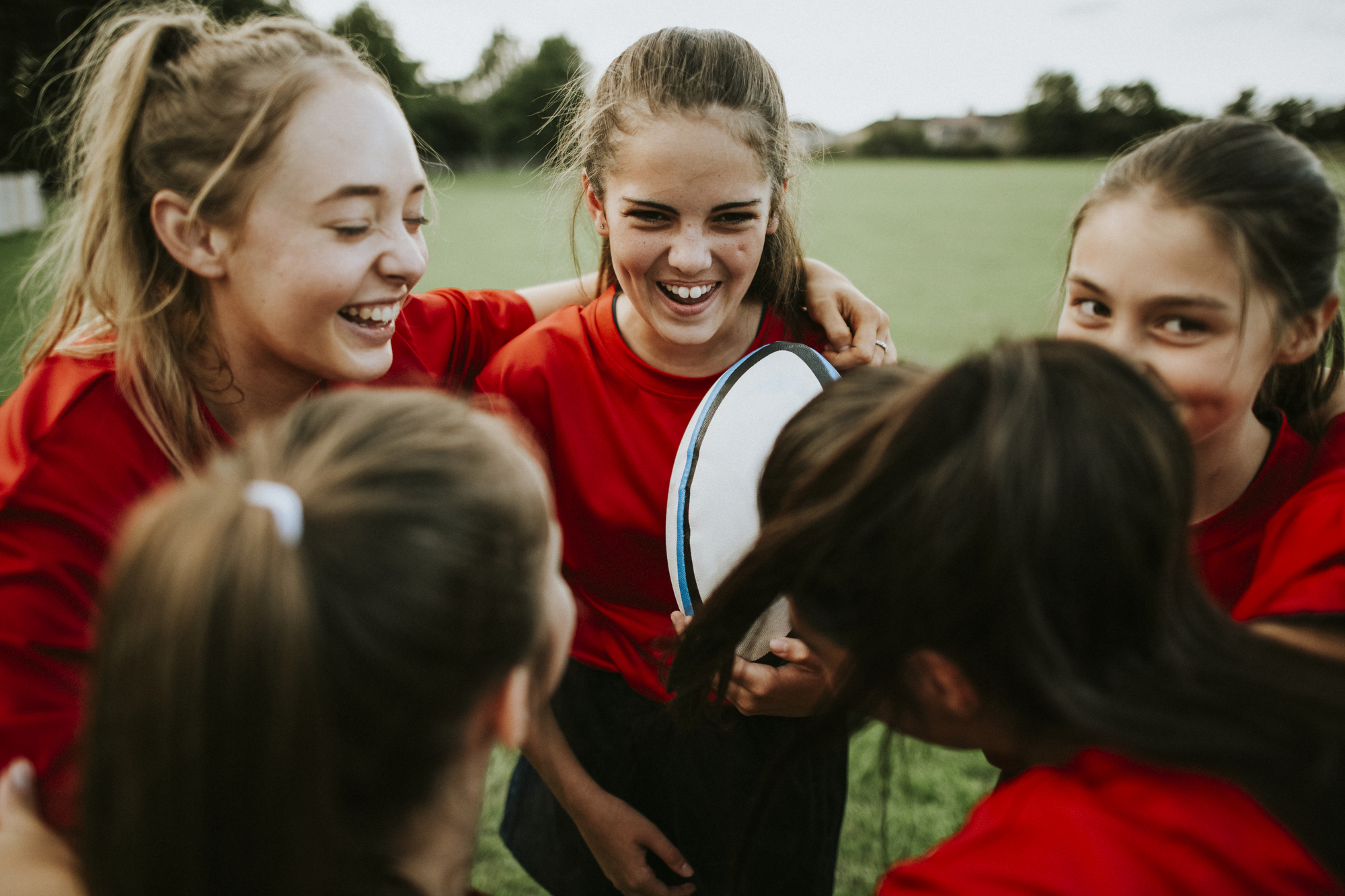 Cheerful young rugby players on the field stock image