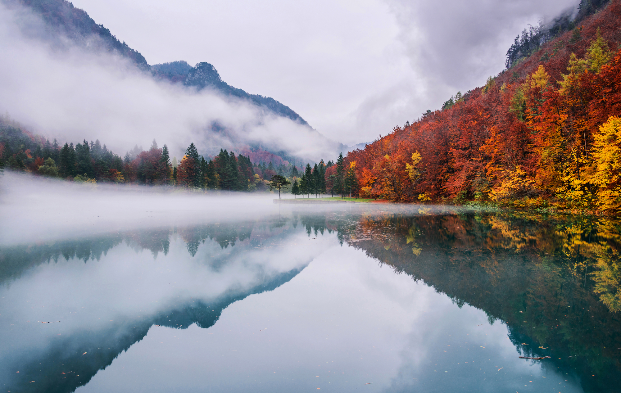 stock photo Autumn reflections at the emerald lake