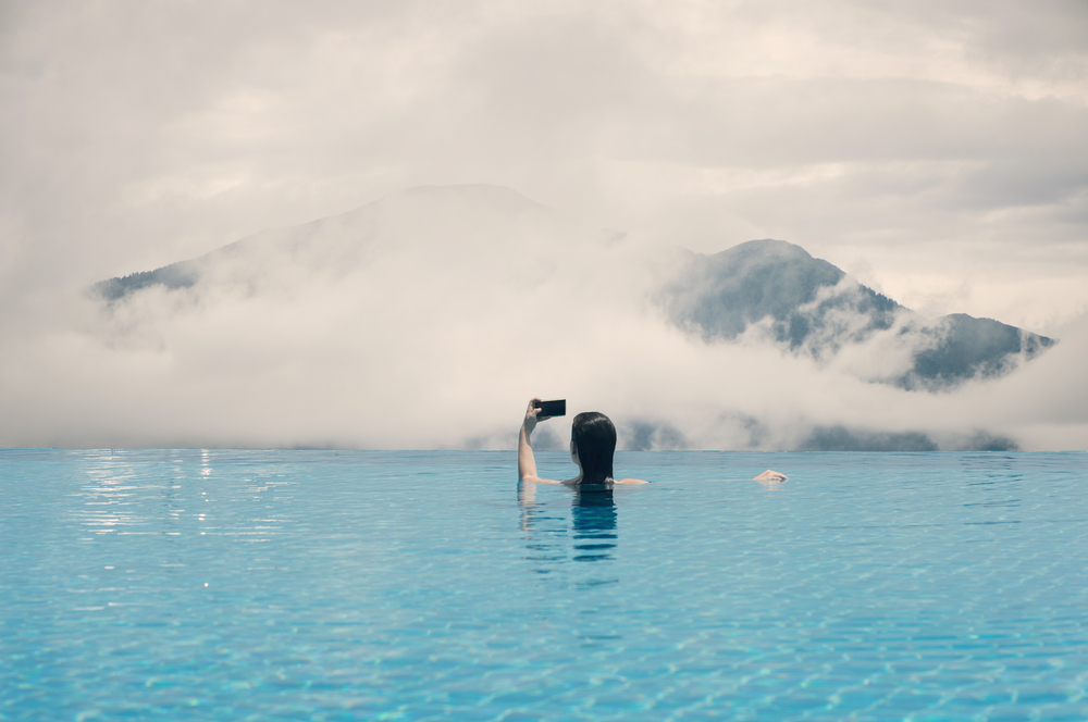 stock photo woman swimming mountain lake