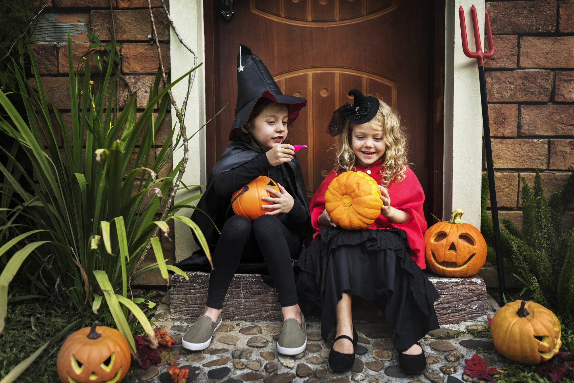 Little kids at a Halloween party stock photo