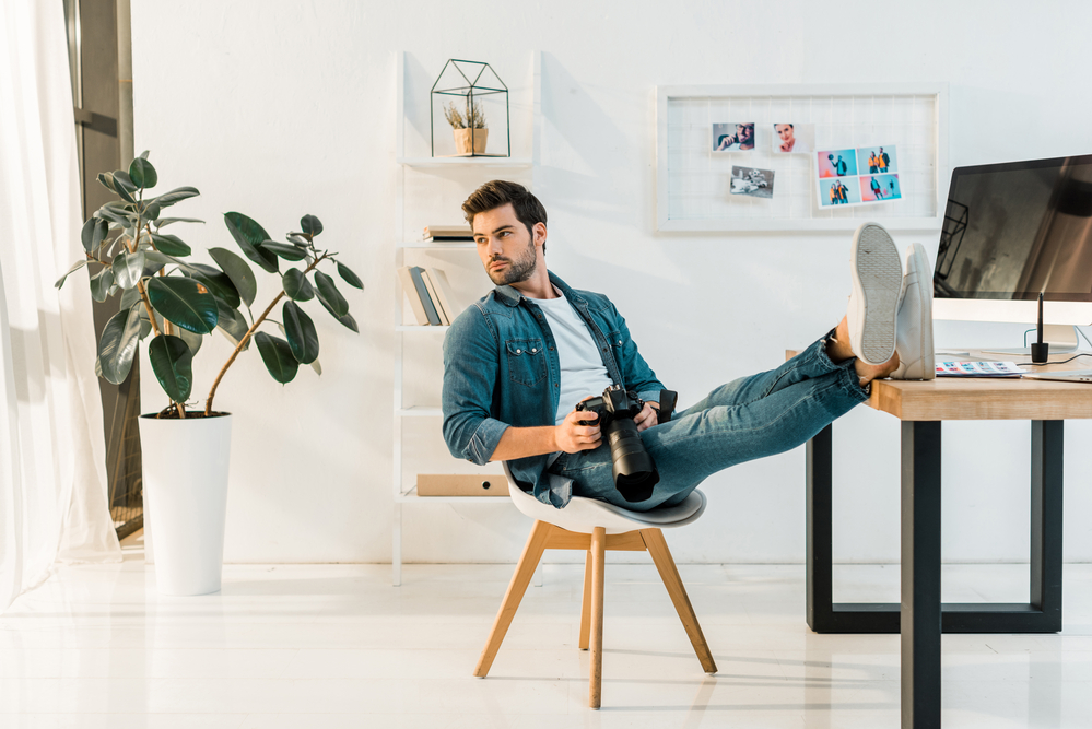 stock photography young photographer sitting