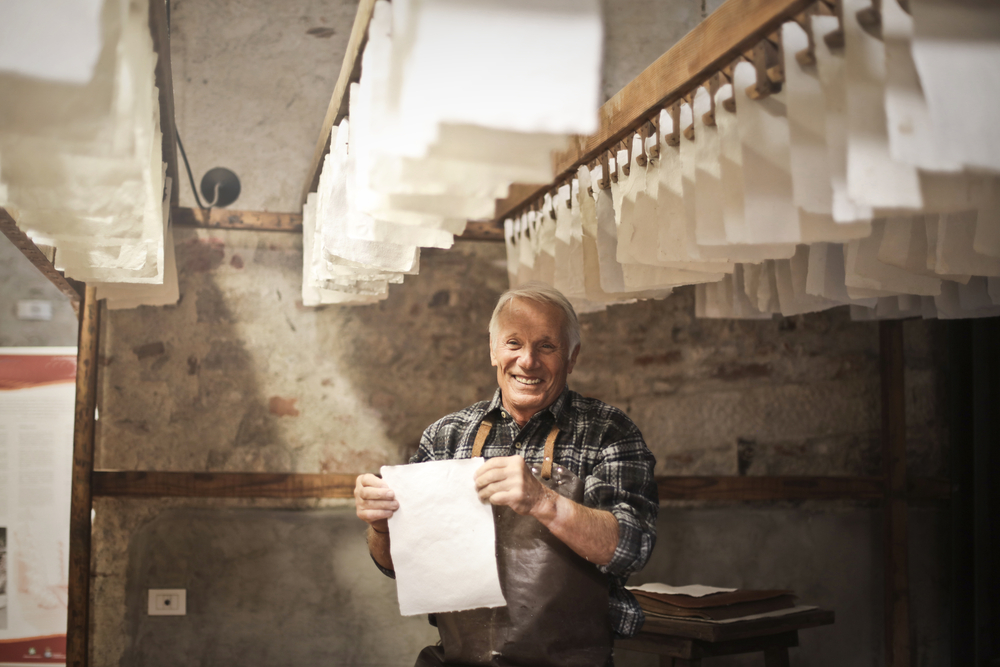 stock photo man crafts paper