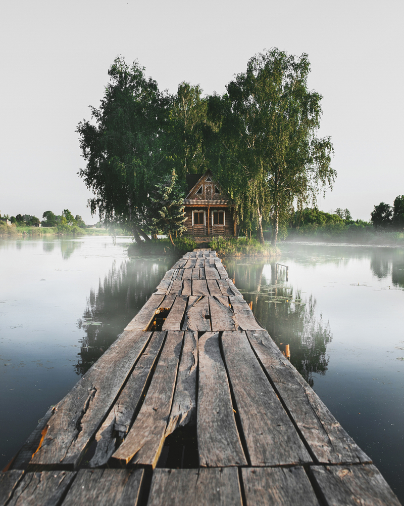 travel photography stock photo wooden house lake