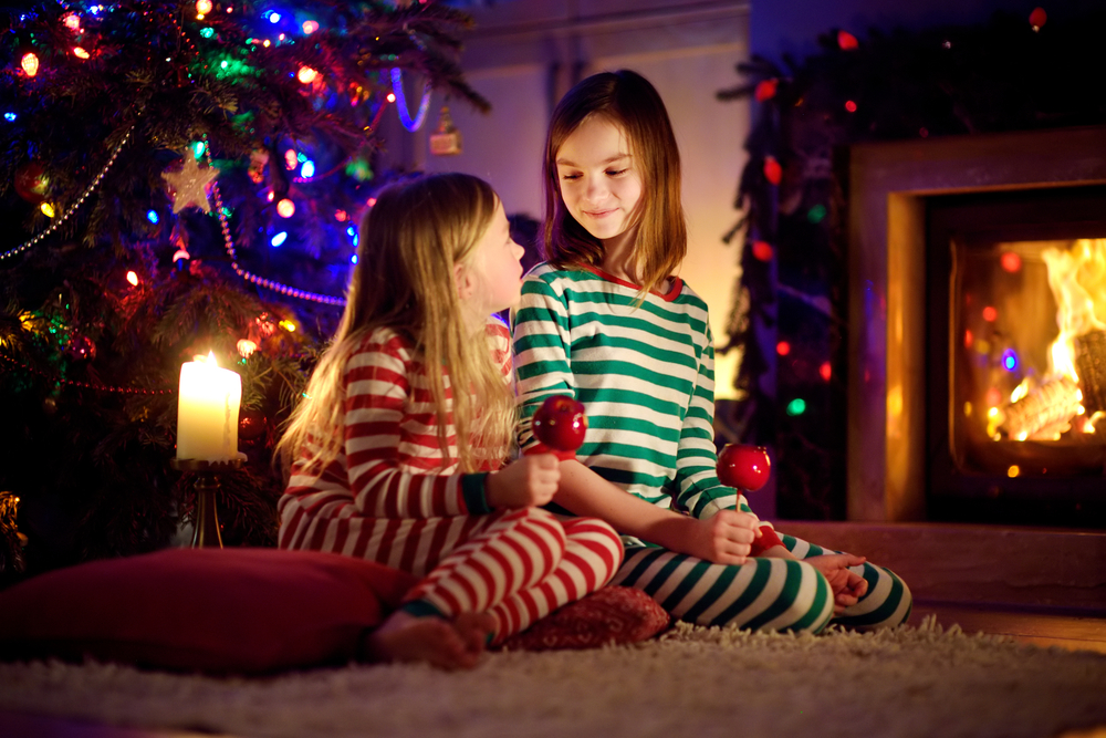 stock photo christmas girls fireplace