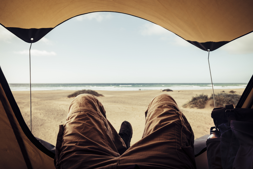 stock photo beach man tent