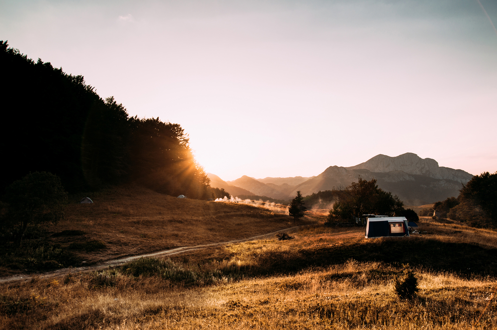 stock photo mountains sunset field