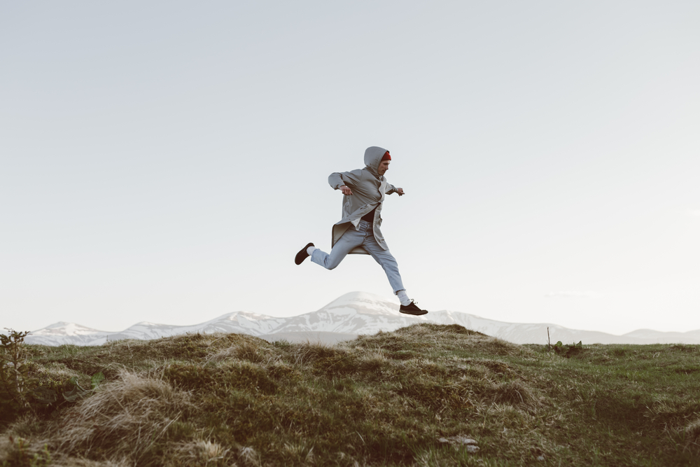 stock photo mountains man jumping