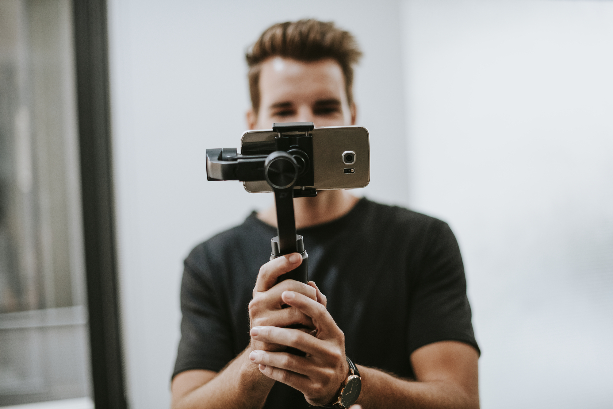 Male videographer filming stock photo