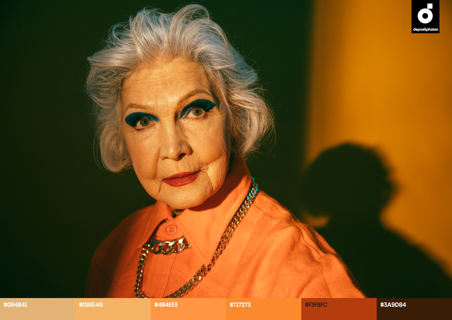 Old Woman standing in fashionable closes indoor - stock image