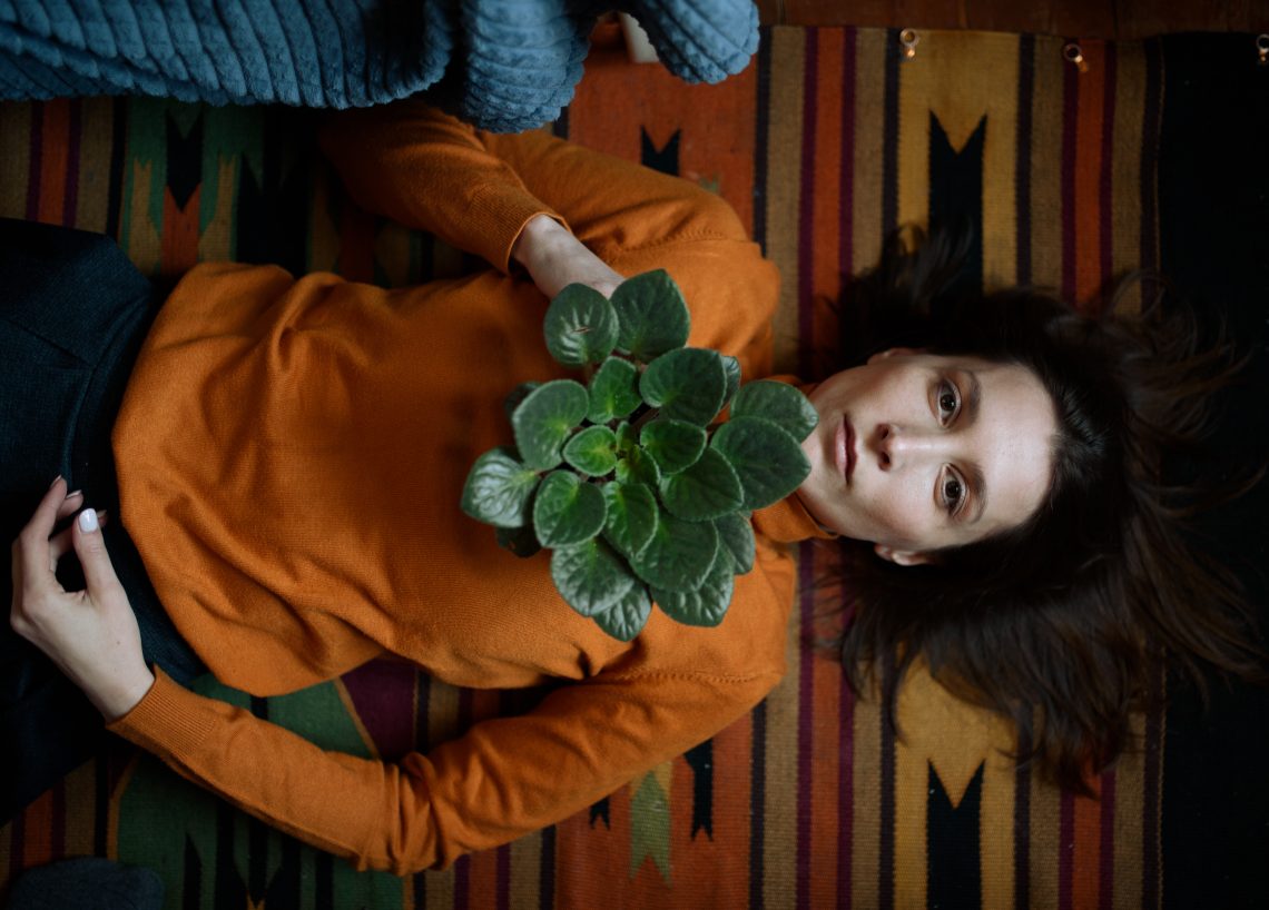 woman with a flower on the floor