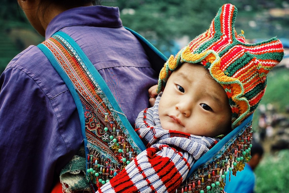 young woman at her traditional house up in the northern mountains