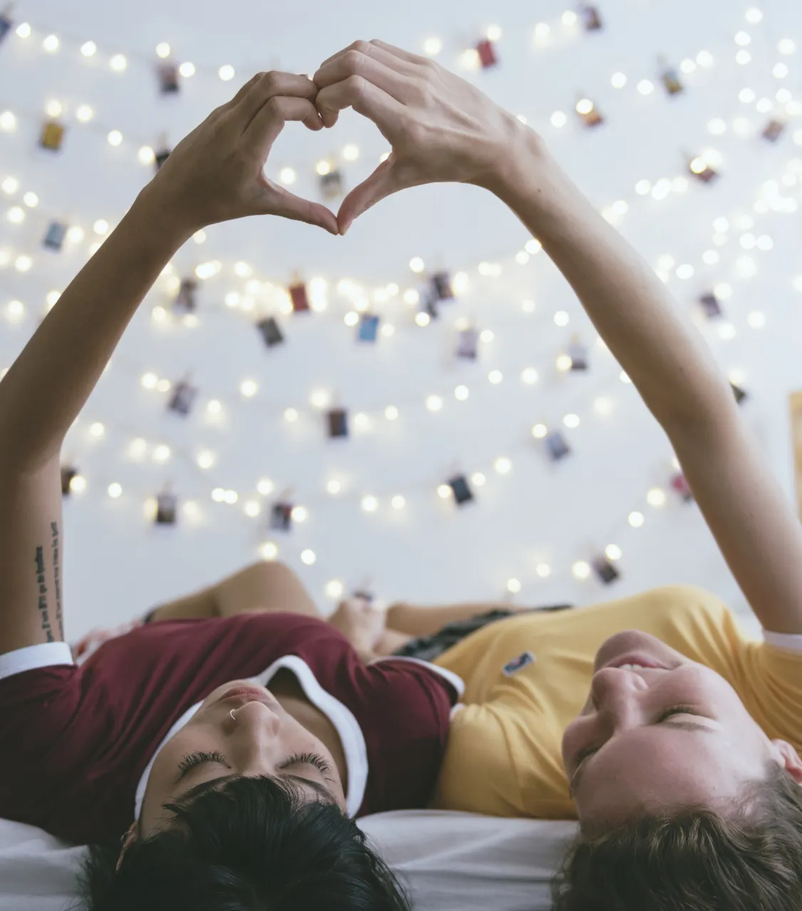 Women lying on the bed together