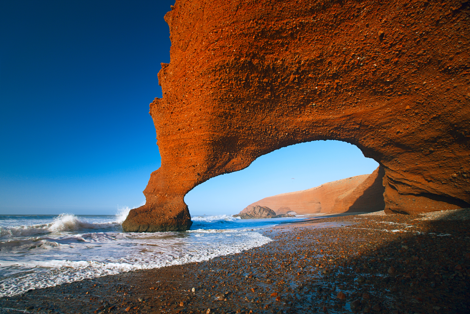 Legzira dramatic natural stone arches reaching over the sea, Atlantic Ocean, Morocco, Africa