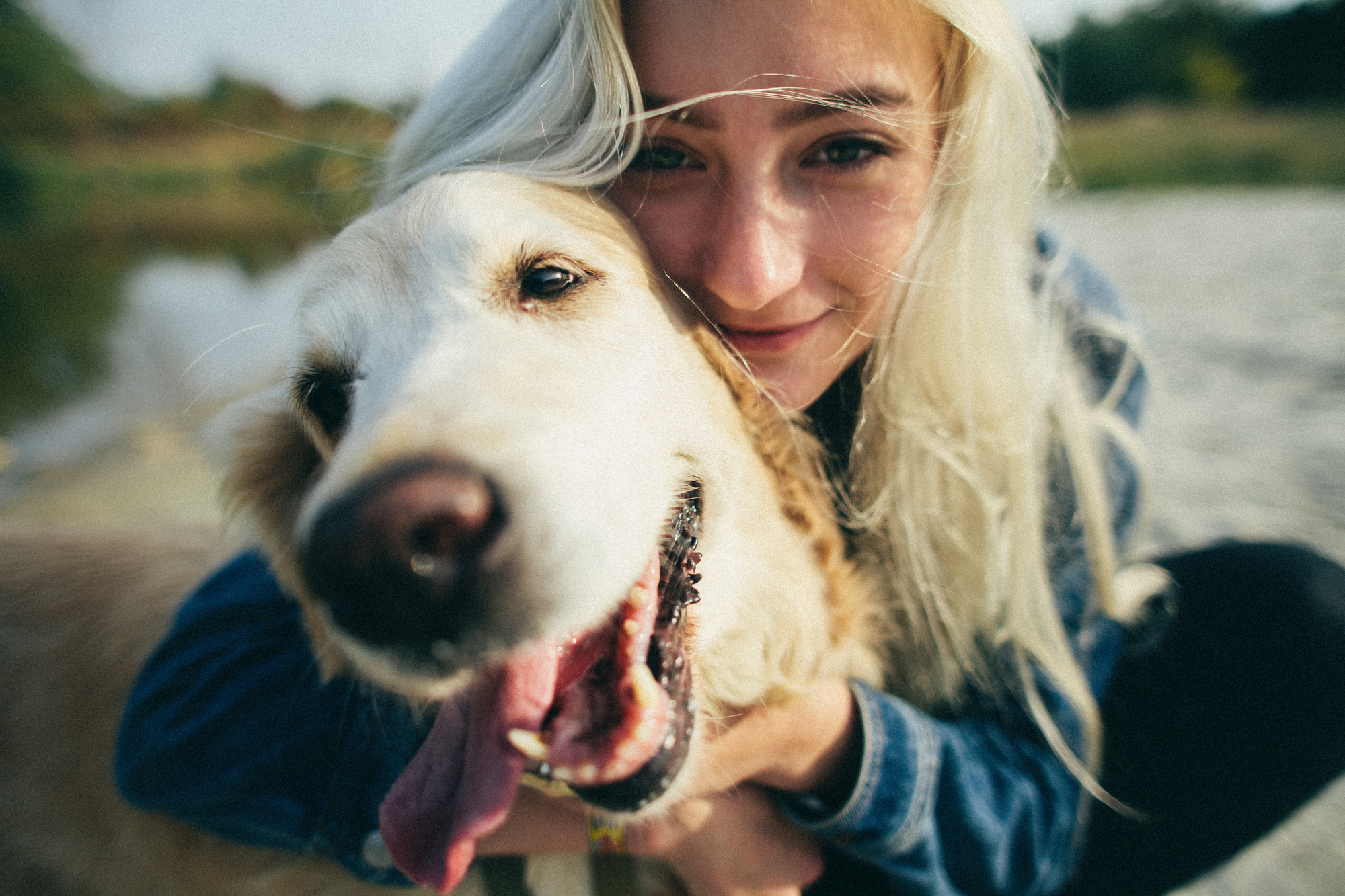 Beautiful woman playing with her dog Outdoor portrait series