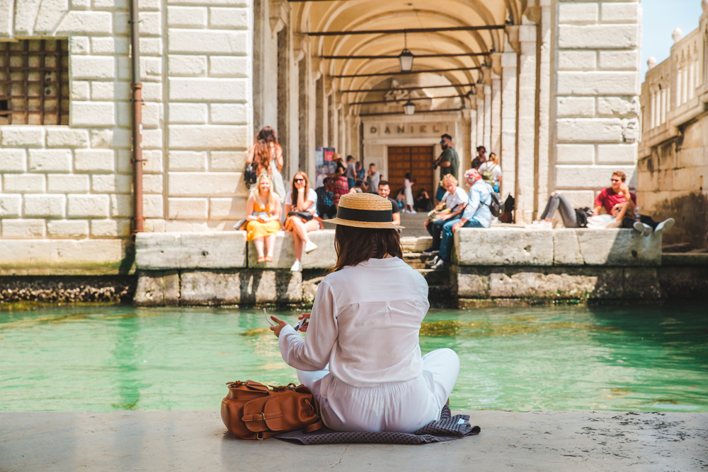 woman looking at gondolas 