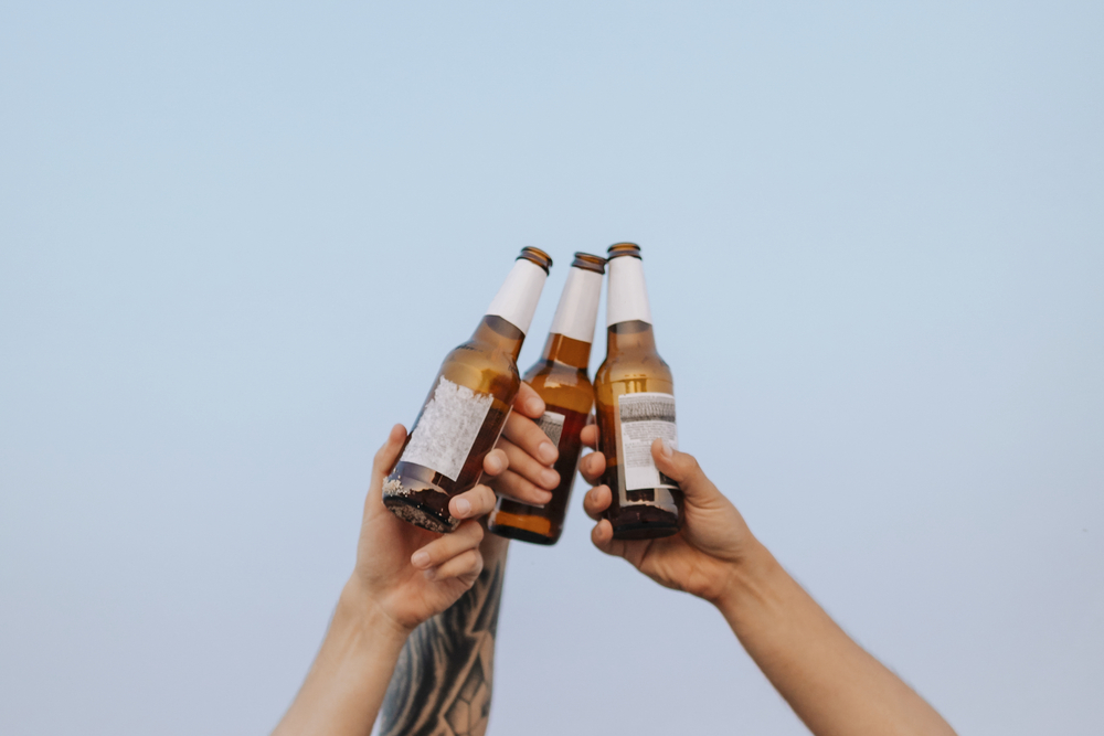 Guys having beers at the beach