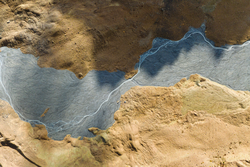 Drone view of the river in the glacier valley. Landscape from the air. 